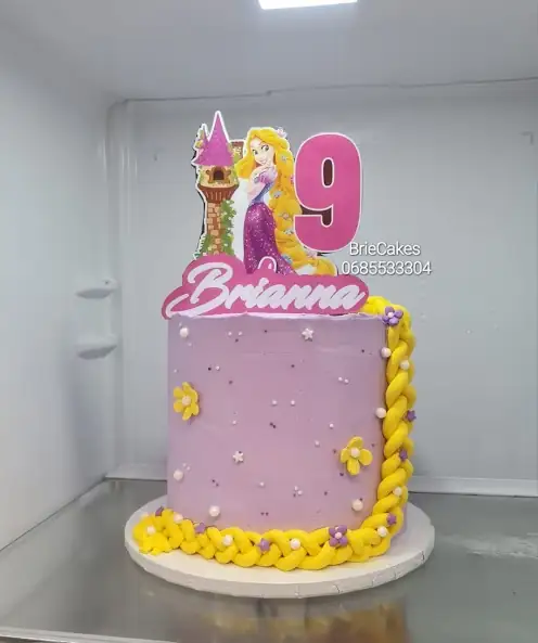 Purple princess birthday cake with braided yellow detail by Brie Cakes