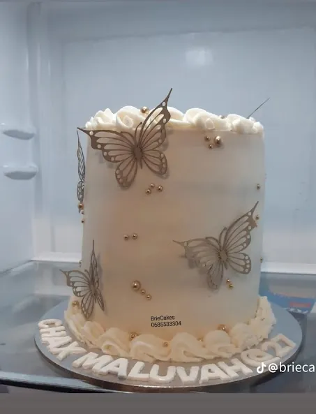 Elegant white butterfly celebration cake by Brie Cakes