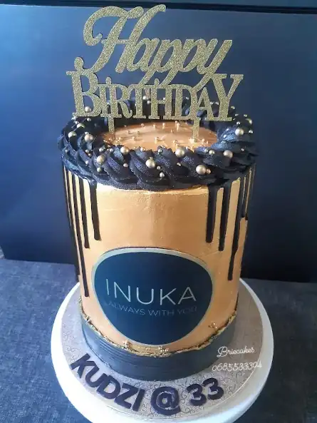 Gold and black adult birthday cake by Brie Cakes